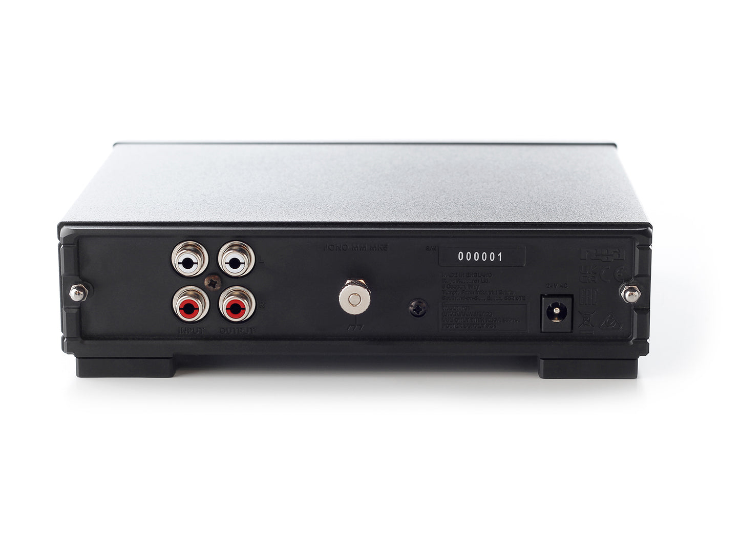 A product image of the rear panel of a Rega Fono MM Phono Stage showing the power socket and RCA inputs and outputs.