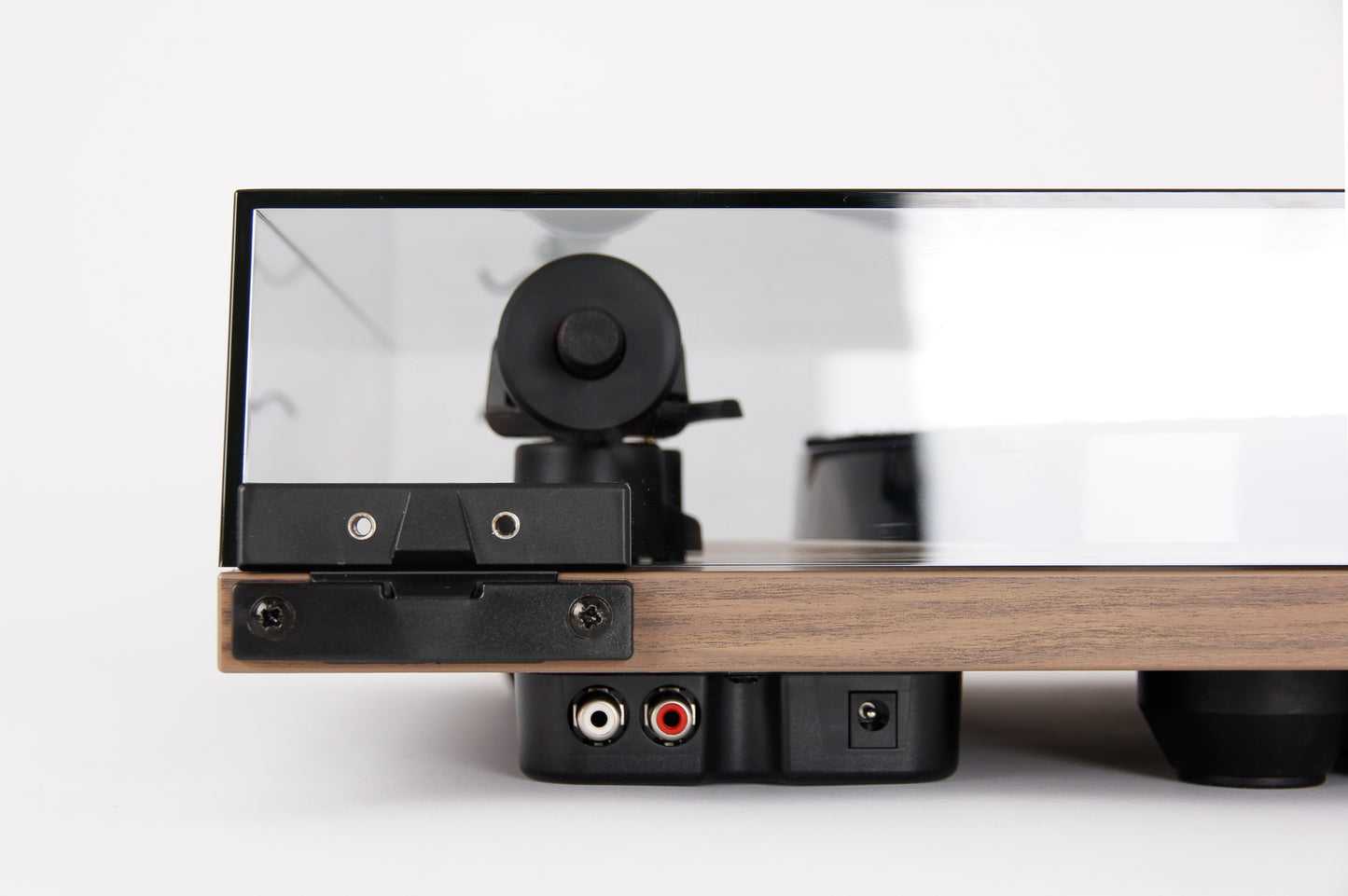 Product image for the rear of a Rega Planar 1 Plus turntable in Walnut finish showing the RCA output sockets and power socket