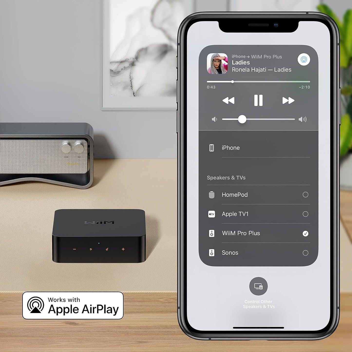 Product image of a WiiM Pro Plus and an iPhone on the right showing Apple AirPlay