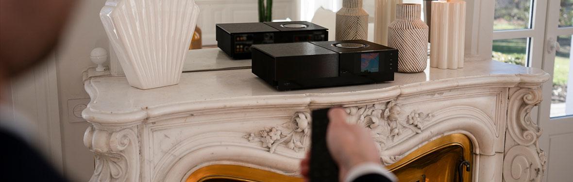 Lifestyle Image of a Naim Uniti Nova Power Edition All-In-One Streaming Amplifier on a mantlepiece.