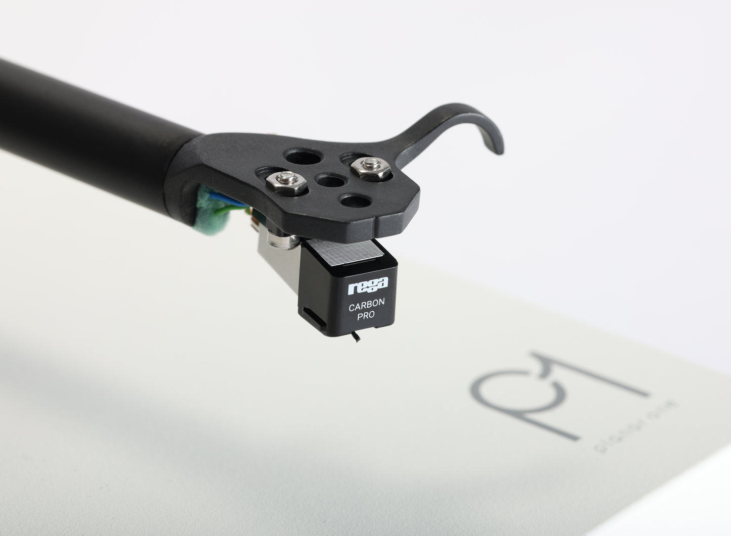Product image of a Rega Carbon Pro Stylus attached to the tonearm of a Rega Planar 1 Turntable.
