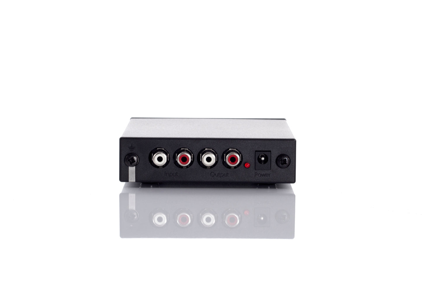 Product image of the rear of a Rega Fono Mini Moving Magnet Phono Stage / Pre Amplifier showing the RCA inputs and outputs and power socket