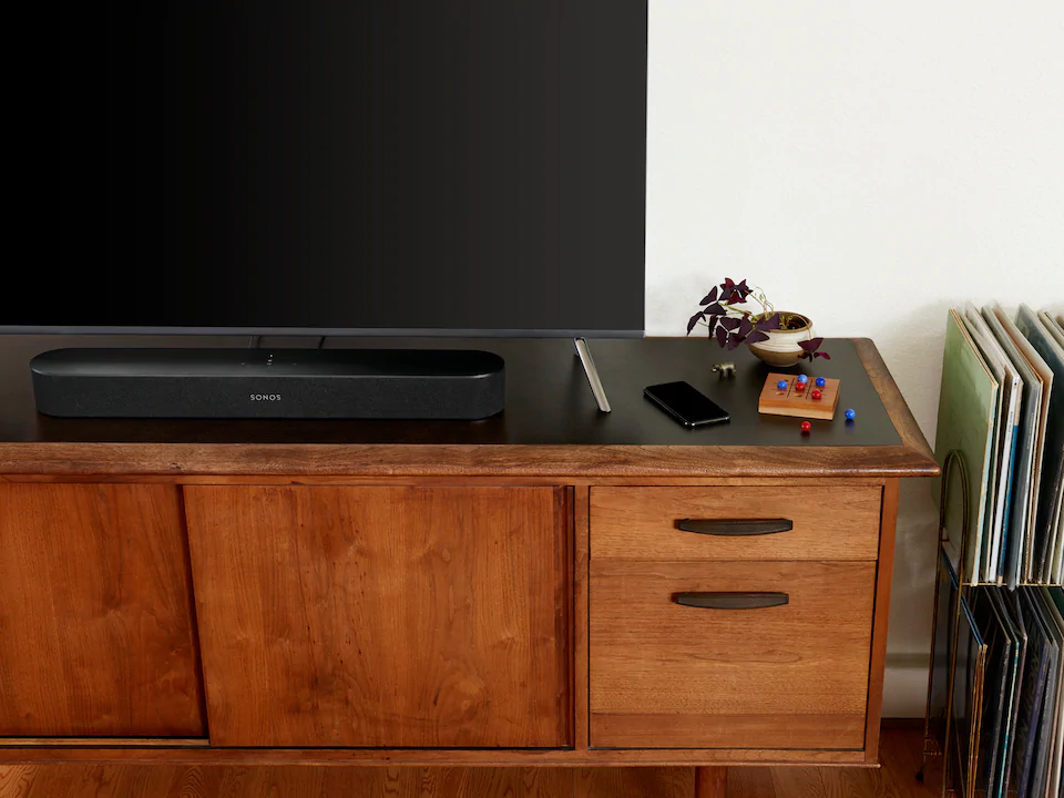 Lifestyle image of a Sonos Beam Gen 2 Soundbar in Black.