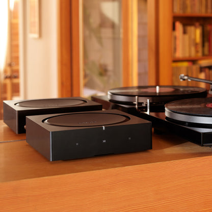 Lifestyle Image of a Sonos Amp in Black.