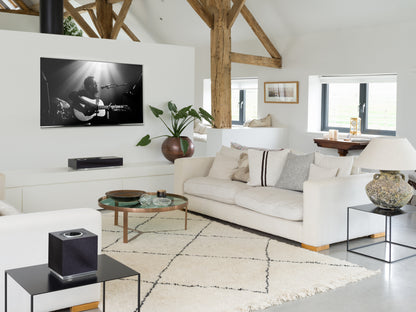 Lifestyle image of a Naim Mu-So 2nd Generation Wireless Speaker and a Naim Mu-So Qb 2nd Generation Wireless Speaker.
