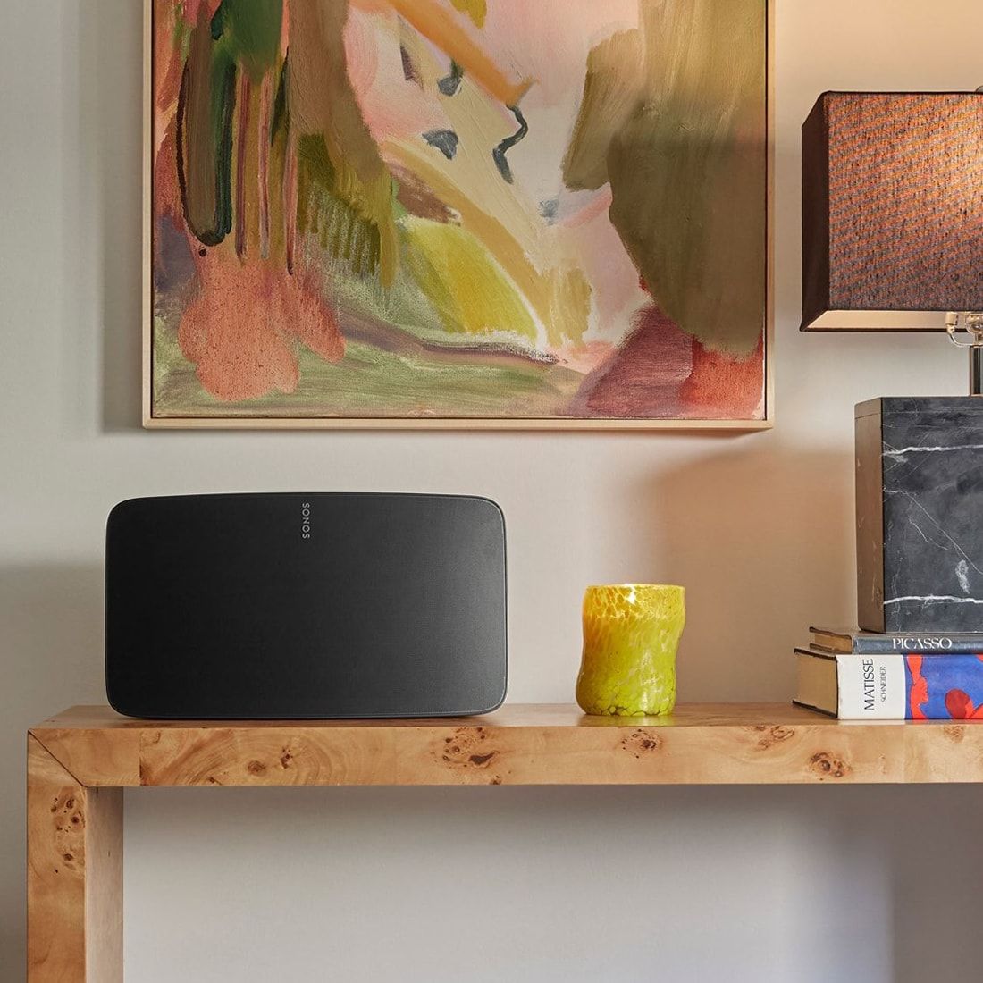 Lifestyle image of a Sonos Five wireless speaker in Black.