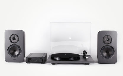 Product Image of a Rega System One turntable package featuring a Rega Planar 1 turntable, Rega io Integrated Amplifier and a pair of Rega Kyte Speakers.