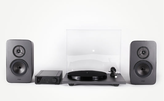 Product Image of a Rega System One turntable package featuring a Rega Planar 1 turntable, Rega io Integrated Amplifier and a pair of Rega Kyte Speakers.