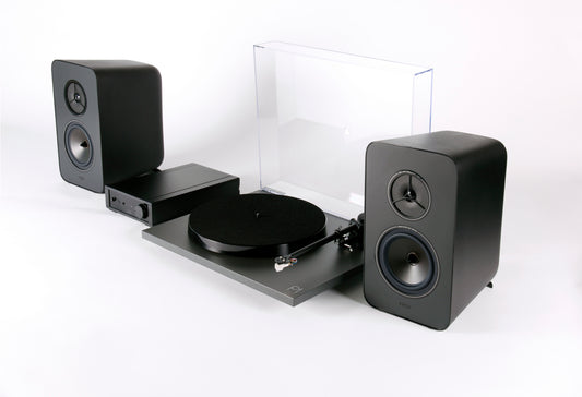 Product Image of a Rega System One turntable package featuring a Rega Planar 1 turntable, Rega io Integrated Amplifier and a pair of Rega Kyte Speakers.