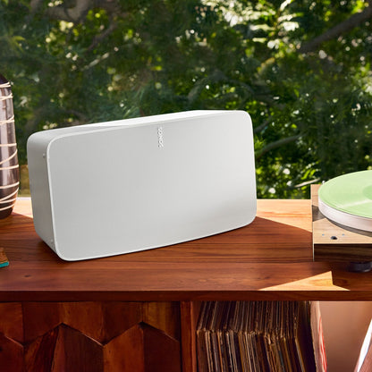 Lifestyle image of a Sonos Five wireless speaker in White.