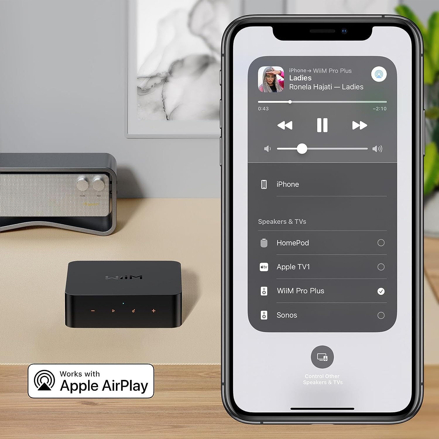 Product image of a WiiM Pro Plus and an iPhone on the right showing Apple AirPlay
