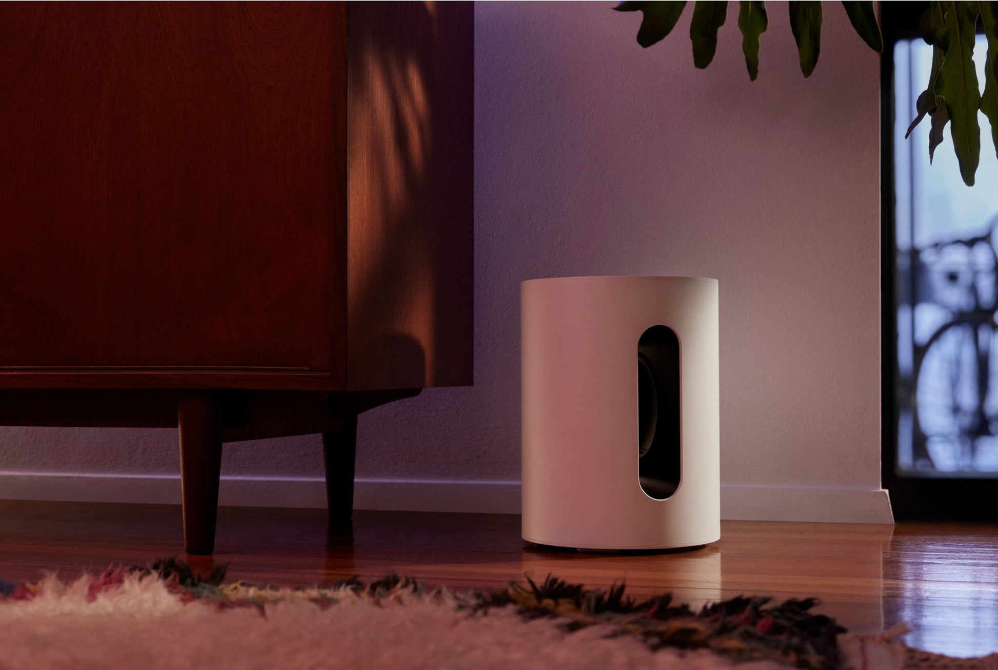 Lifestyle image of a Sonos Sub Mini Wireless Subwoofer in Black.