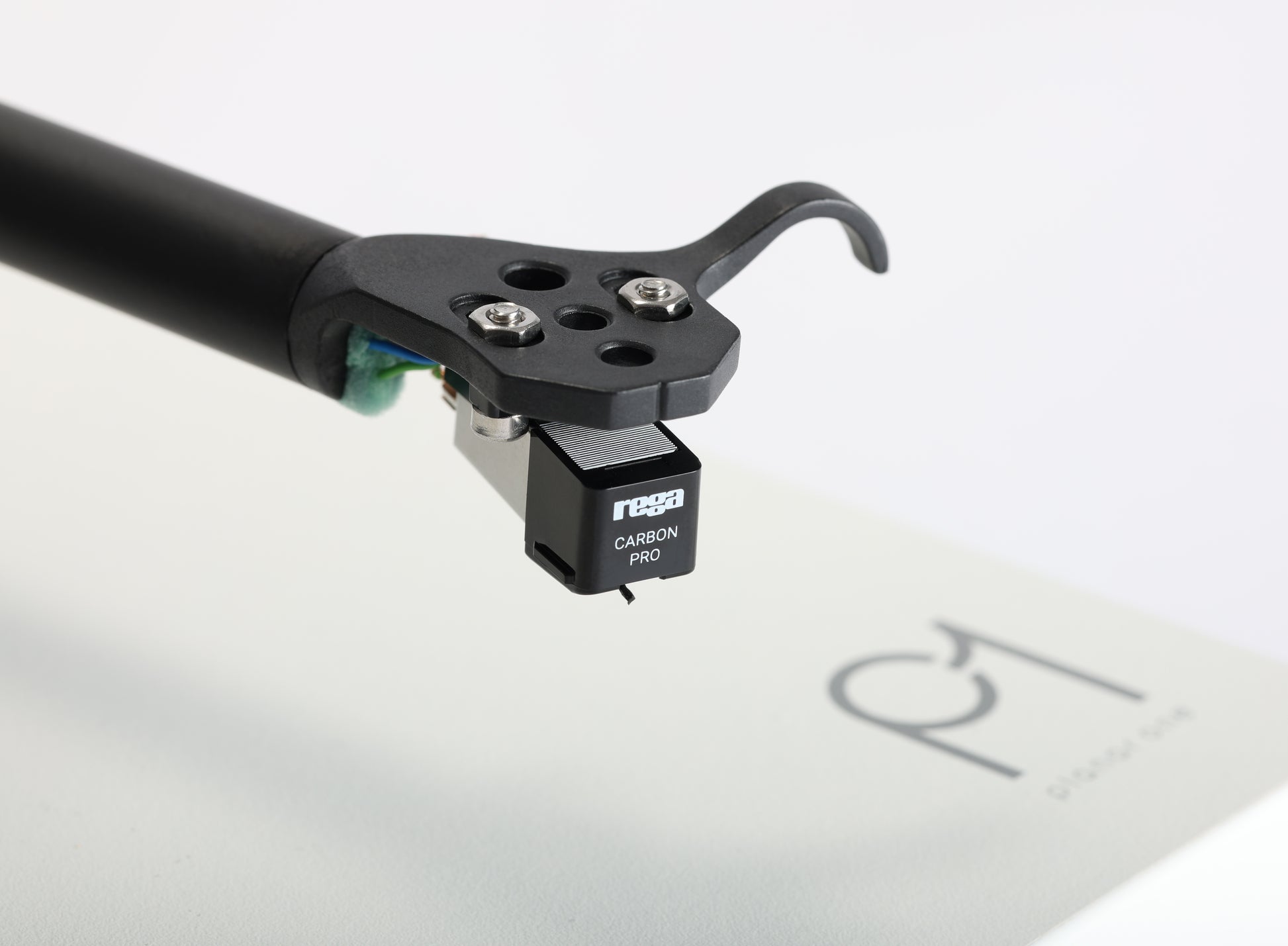Product image of a Rega Carbon Pro Stylus attached to the tonearm of a Rega Planar 1 Turntable.