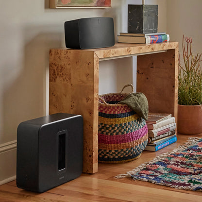 Lifestyle image of a Sonos Sub gen 4 in Black.